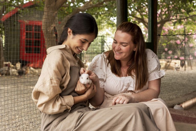 medium-shot-smiley-women-with-cute-rabbit